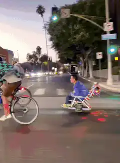 Man rides lawn chair scooter with lights
