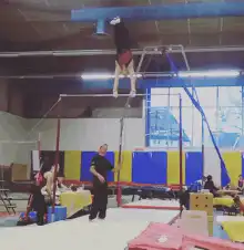 Gymnast falls off uneven bars