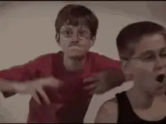Two boys dancing and making faces