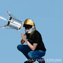 Person with jetpack helmet and rocket