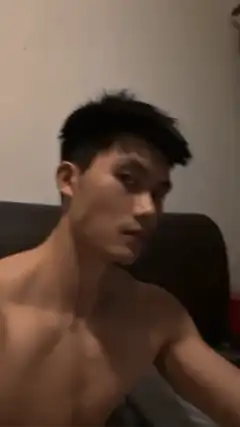shirtless man flexing bicep