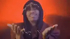 Snoop Dogg dancing with hand gestures