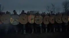 Vikings shield wall with torches