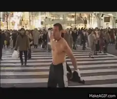 shirtless man dancing in crowd