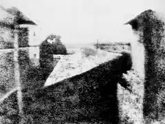 Grainy black and white photo of a balcony view