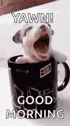 Yawning puppy in a mug good morning