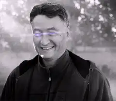 Man with glowing purple laser eyes