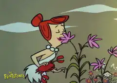 Wilma Flinstones smells flower