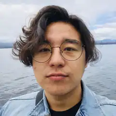 Man with glasses by the lake