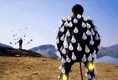 Man with lightbulbs on his back