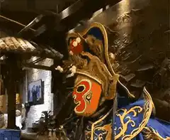Chinese opera performer changing masks
