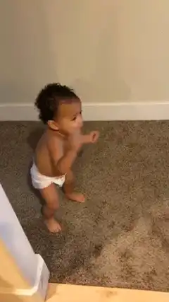 Baby in diaper dancing