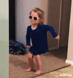 toddler dancing in sunglasses