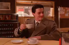 Dale Cooper sips coffee