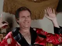 Will Ferrell in red robe dancing