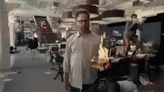 Seth Rogen holding a flaming log with an ostrich