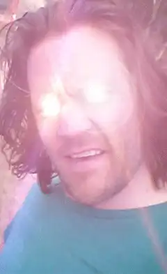 Man with glowing Bitcoin eyes