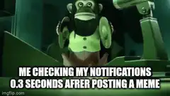 Monkey checking notifications after posting a meme